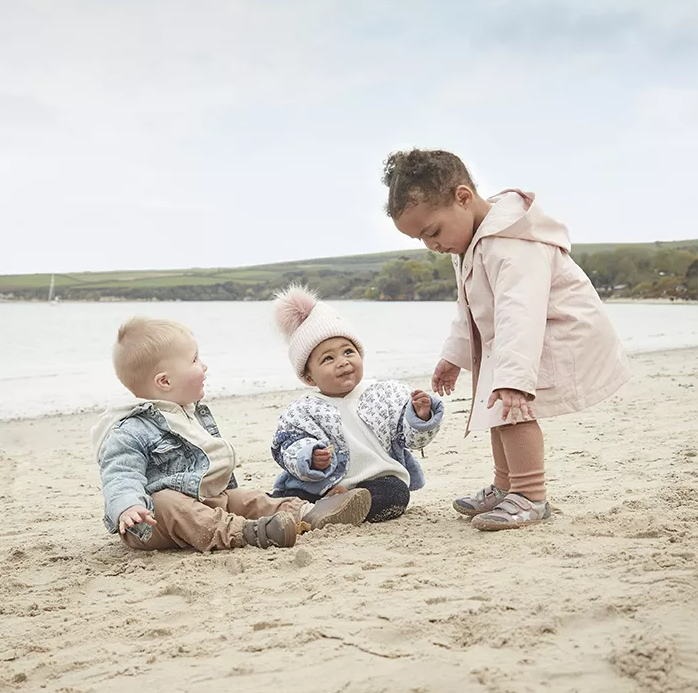 Babies playing on the beach